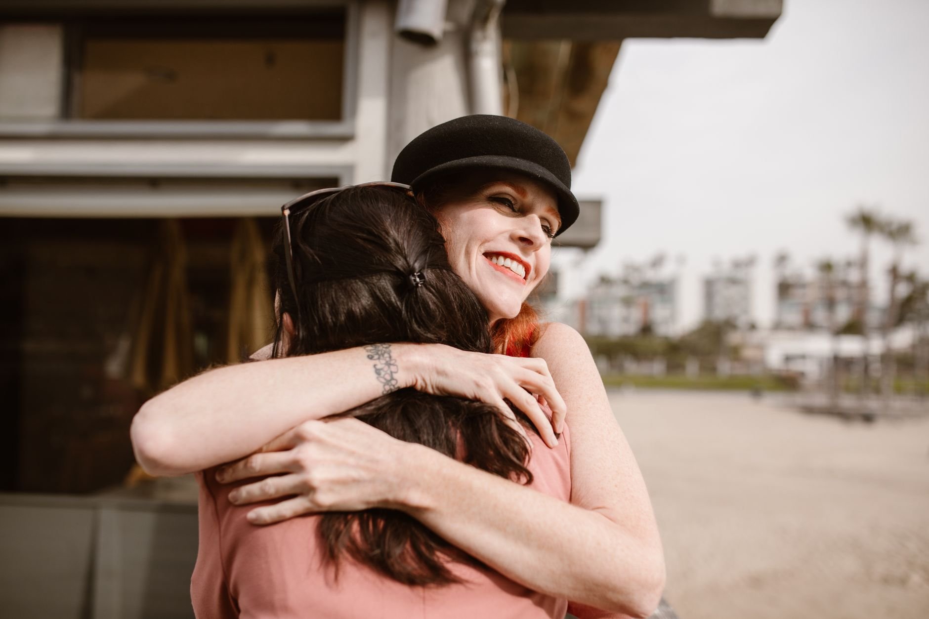 Two women embracing warmly, expressing friendship and support